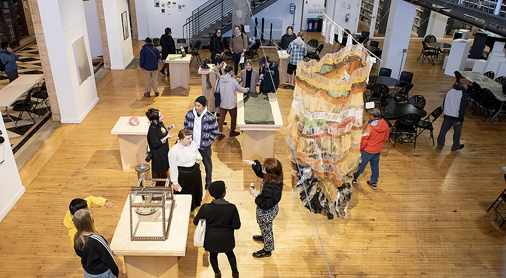 Visitors and students at an art showing at PNCA campus in Portland.