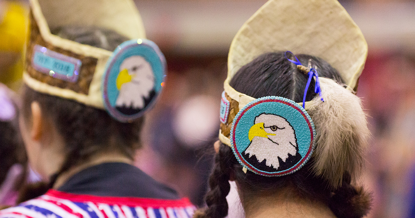 Bald eagles adorn the regalia worn on two women’s head at the Social Pow wow.