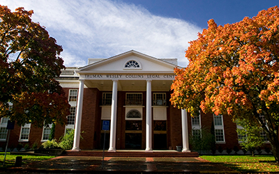 Willamette College of Law building with autumn colored trees