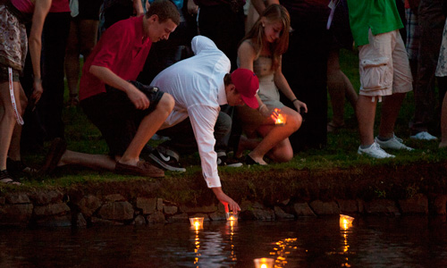 During the matriculation ceremony, students place lit candles into the Mill Stream to signify the start of their journey at Willamette University. 