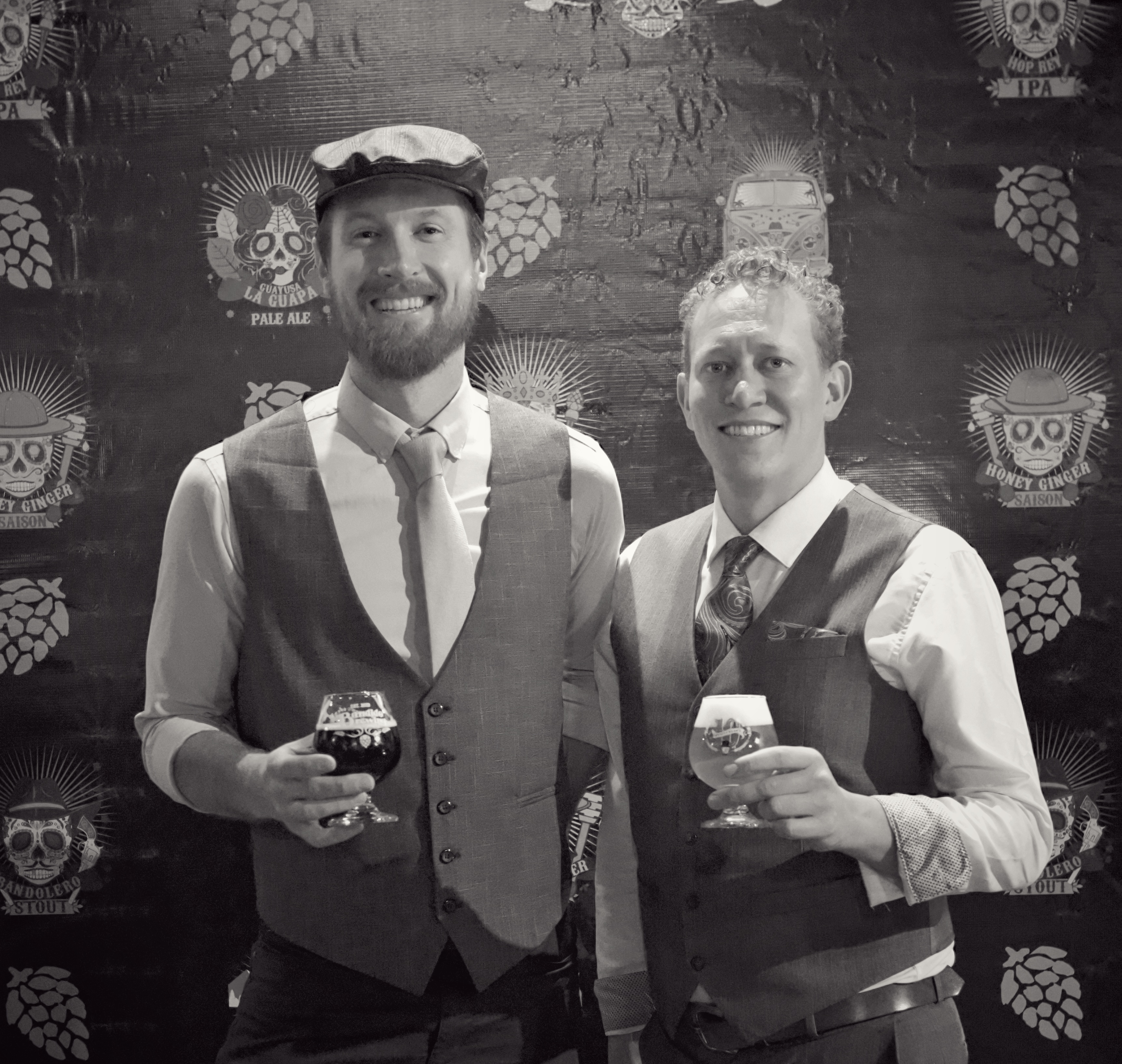 old fashioned photo of 2 men holding drinks