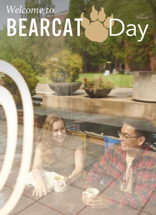 Welcome to Bearcat Day - Two students sitting in the window of the Bistro