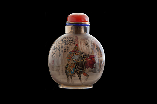 Compressed ovoid-shaped snuff bottle with warrior (probably Guan-di) on horseback