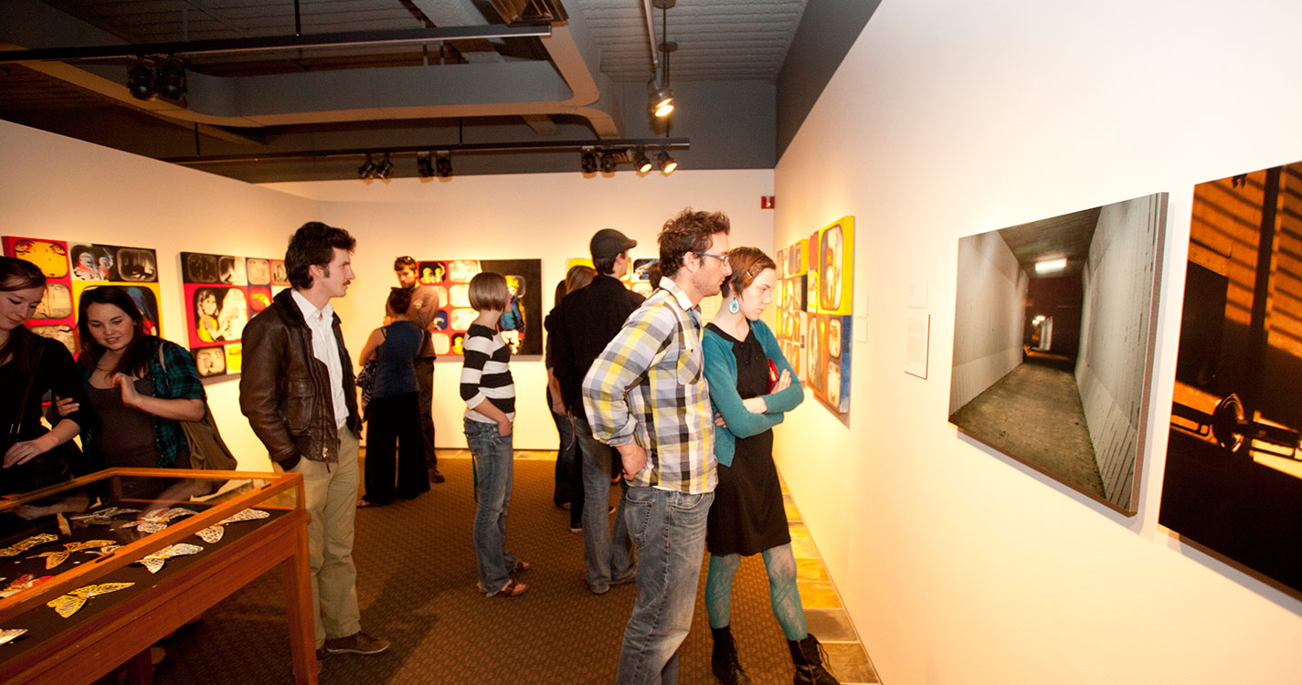 People viewing the work from senior art students from Willamette