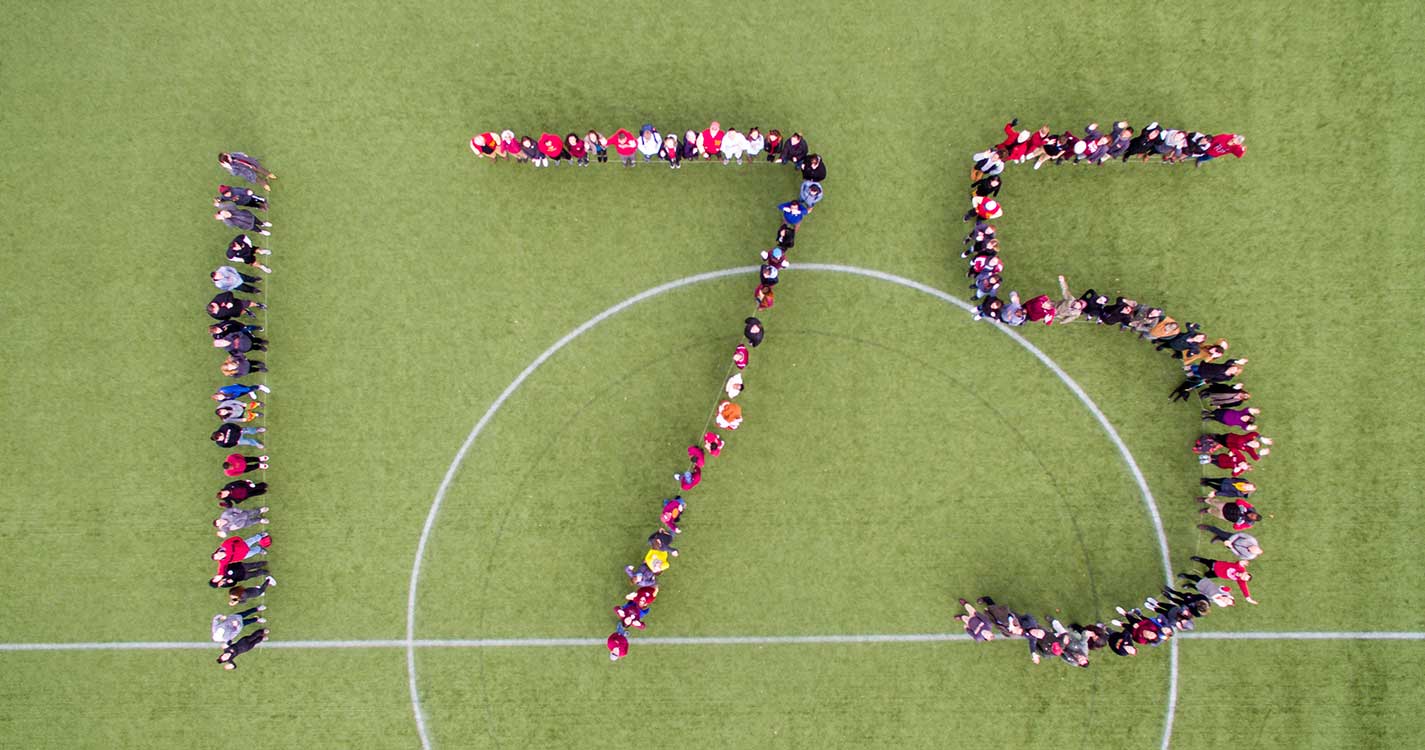 students, faculty and staff form a giant 175