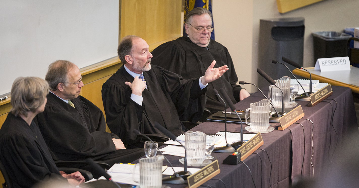 Oregon Supreme Court Justice Jack Landau addresses the audience following a hearing held at Willamette Law March 3, 2017.