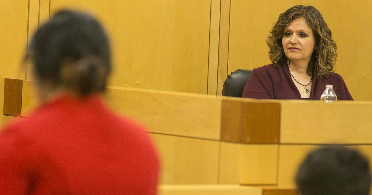 Judge Darleen Ortega listens during the mock trial culminating the end of the Discover Law spring break program put on by Willamette student organization, Street Law.