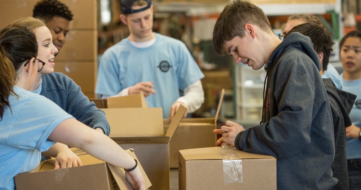 Students pack boxes as part of Willamette’s Global Day of Service.