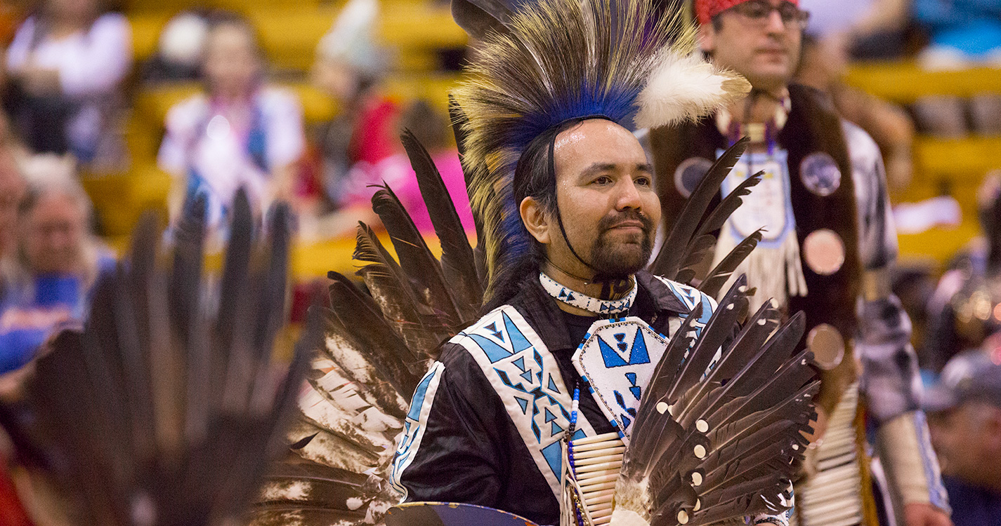 A man dressed in traditional regalia dances in the annual Social Pow wow. 