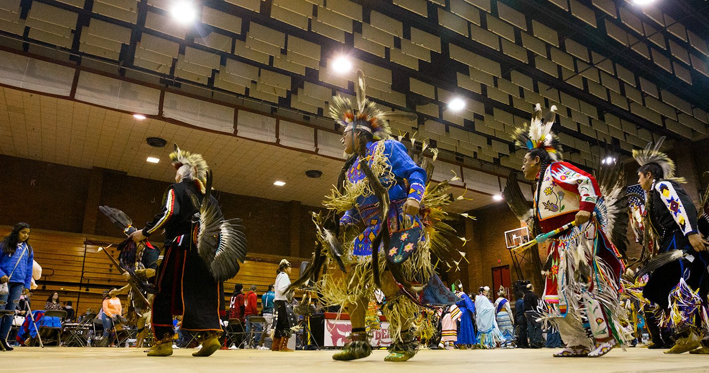 Men in traditional regalia dance in the annual Social Pow wow. 