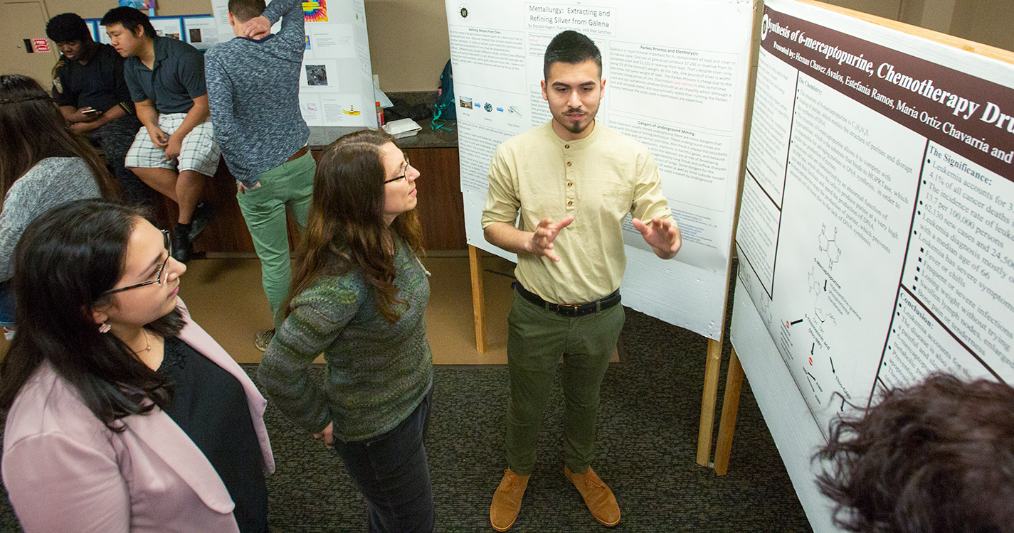 A student presents a poster at Student Scholarship Recognition Day. 