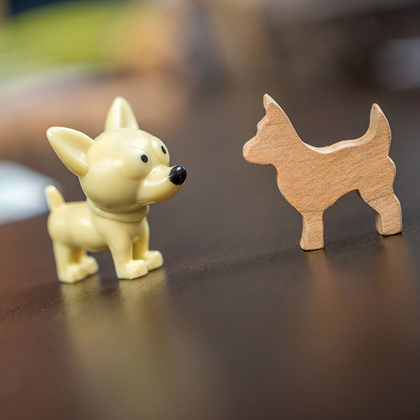 wooden dog model next to finished plastic chihuahau figure
