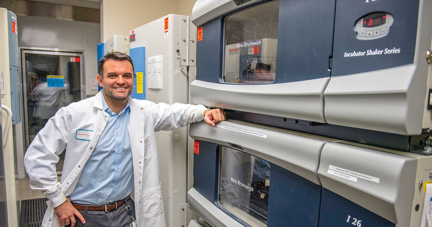 Bioscientist Travis Stiles ’05 stands in his lab