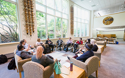 Dean Bridgeman and new 1L students sit in chairs arranged in a circle