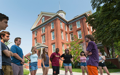 Waller Hall with students standing in front 