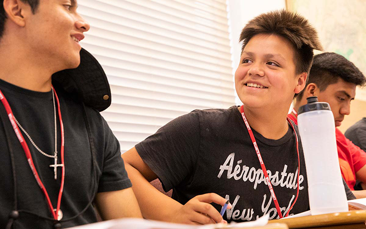 Willamette Academy student smiles while sitting in a classroom