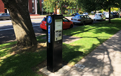 electronic parking station on Winter Street with College of Law in background