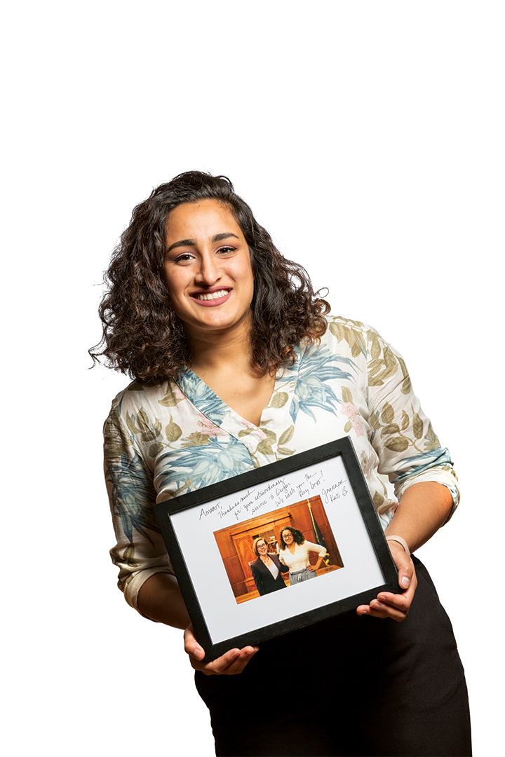 Amarit Ubhi ’20 holds photo of self with Gov. Kate Brown