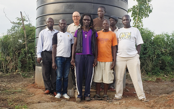 Jon Steiner (third from left) in the Kenyan village where his nonprofit installed a well to provide clean water.