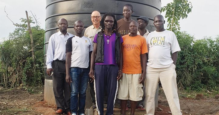 Jon Steiner (third from left) in the Kenyan village where his nonprofit installed a well to provide clean water.