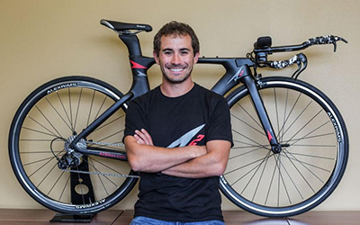 AJ Alley stands with his original carbon fiber Speed Phreak bicycle 