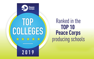 blue badge logo; text: Peace Corps Top Colleges 2019 Ranked in the Top 10 Peace Corps producing schools peacecorps.org