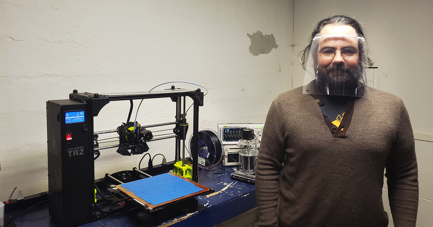 Assistant Professor of Physics Daniel Borrero wears one of many face shields he made for health care workers.