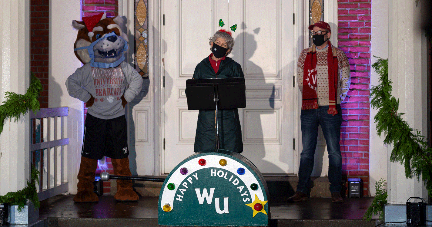 president steve thorsett, chaplain karen wood, and blitz the bearcat standing in front of Waller Hall