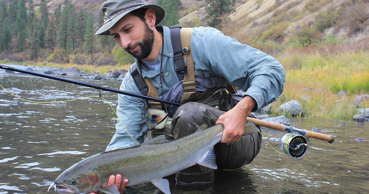  Anton Chiono ’06 stands at the Grand Ronde River after catching and releasing a fish.