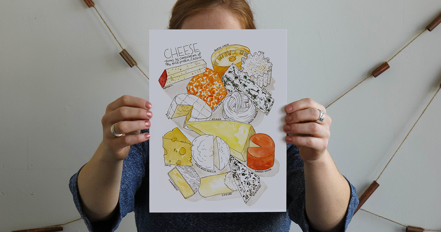 Kriebel holds print of a cheese board