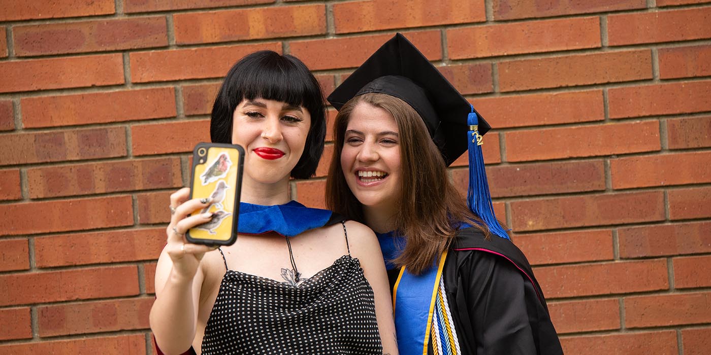 grads taking selfies