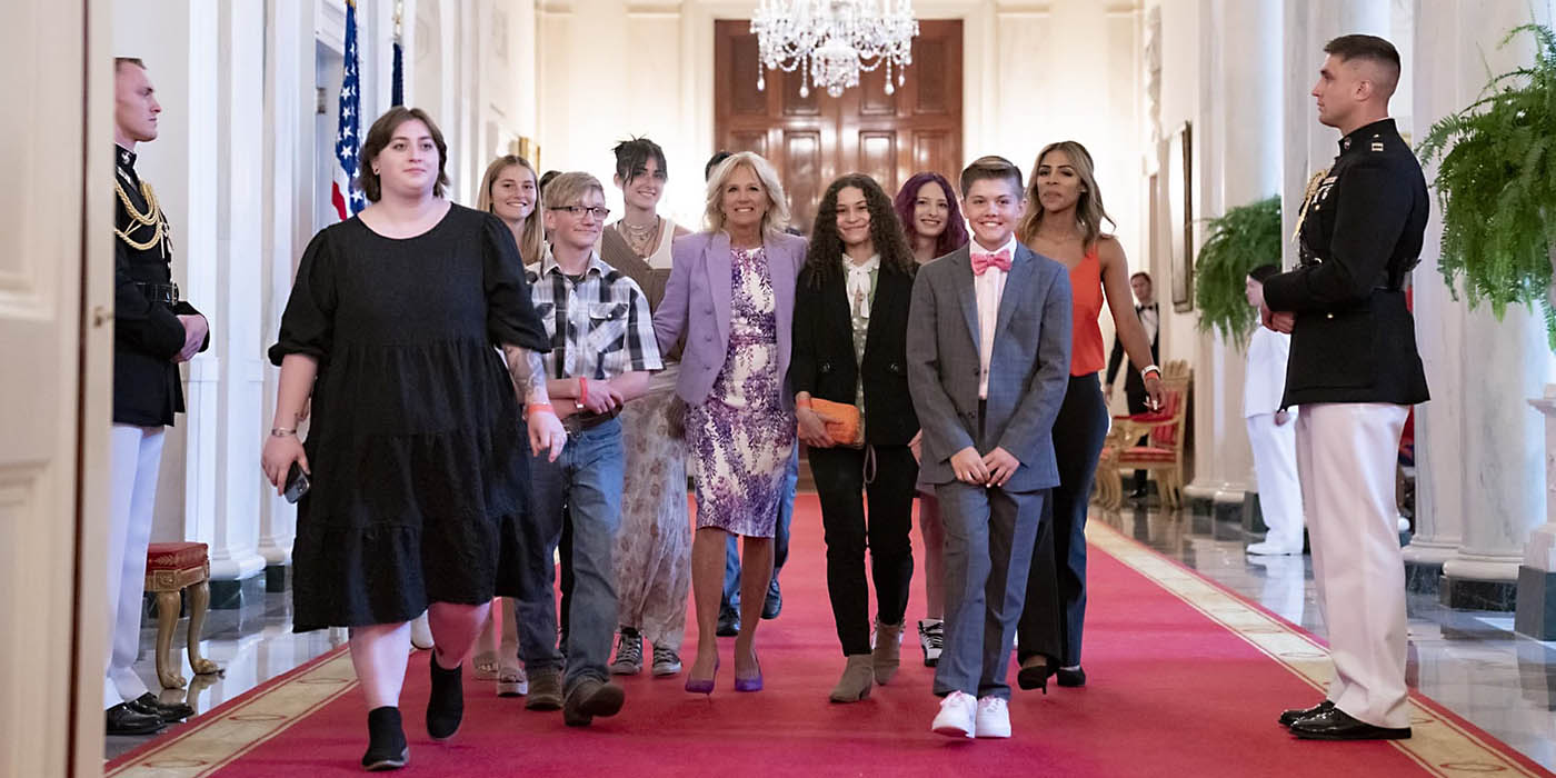 Henderson and other documentary participants walking with First Lady Jill Biden at the White House