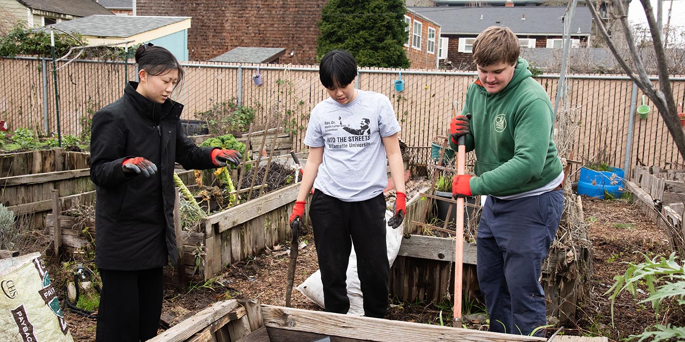 Students digging into the garden