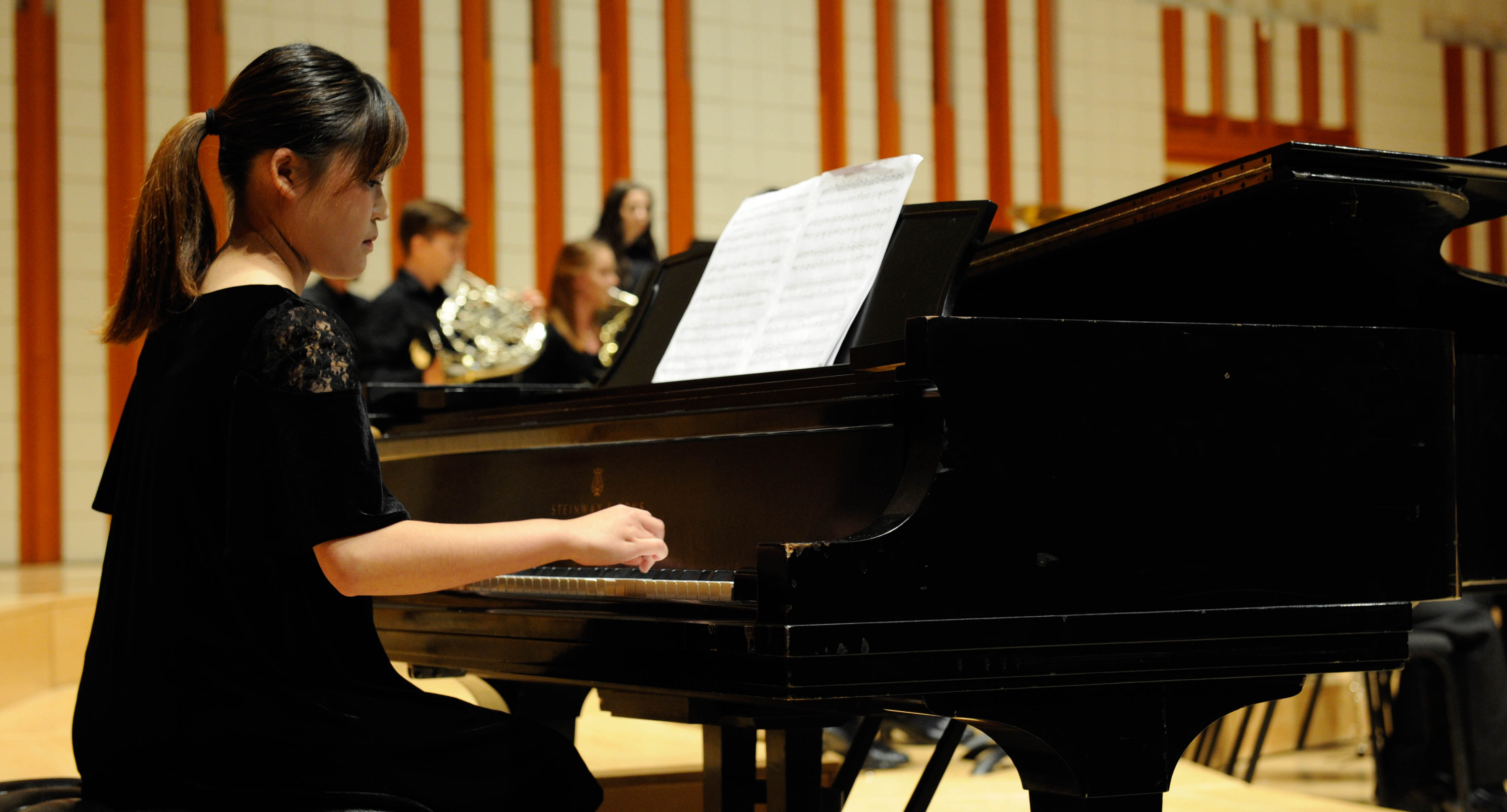 Pianist performing in a concerto setting