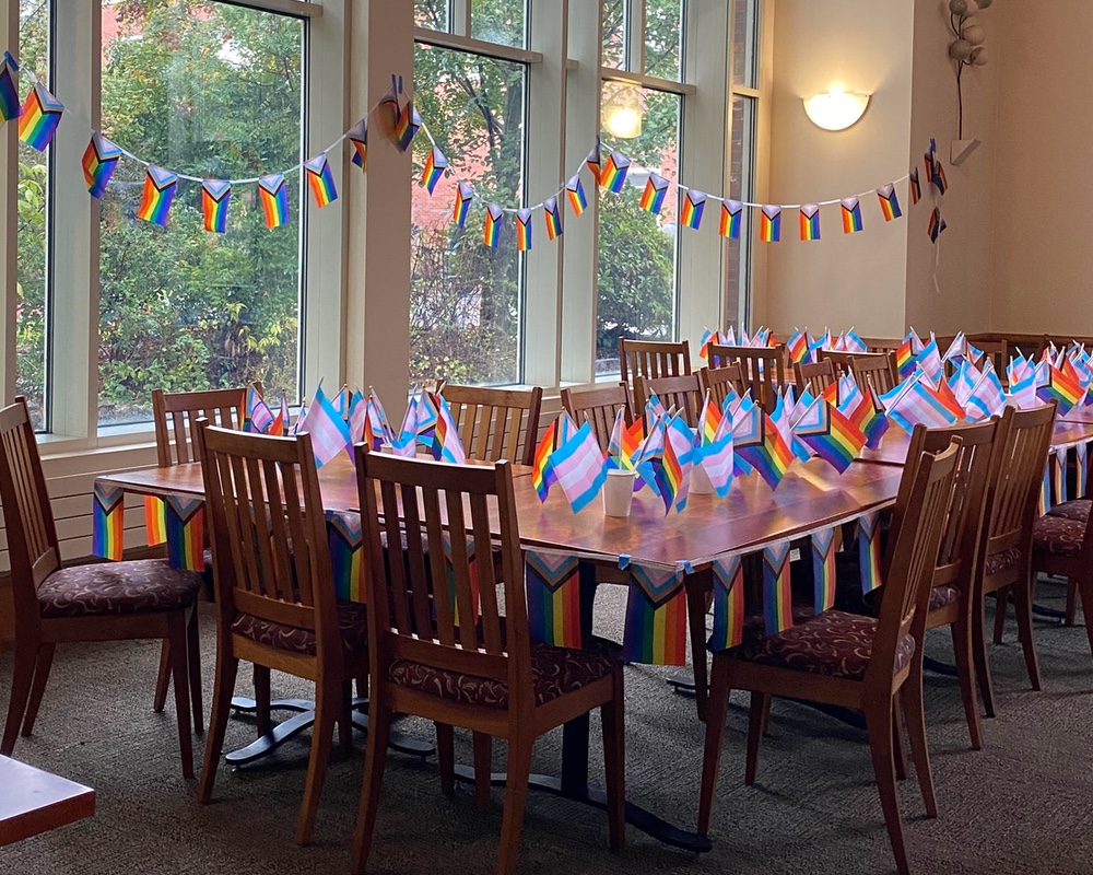 Tables in Goudy decorated with pride flags for Coming Out Day.