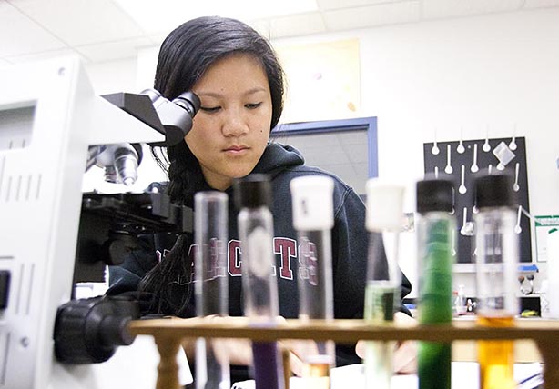 Willamette University student studying in a lab