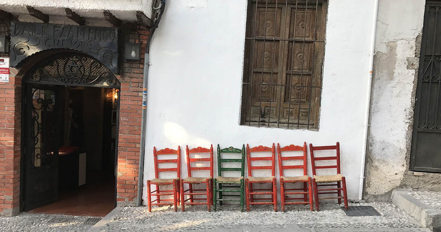 Chairs in front of an old building