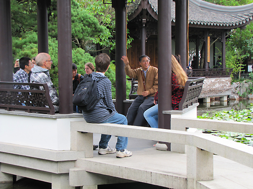 Professor Zhang talks about gardens, music and Chinese culture during a trip to the Chinese Garden in Portland