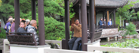Enjoying the beautiful flute and views at the Chinese Garden in Portland
